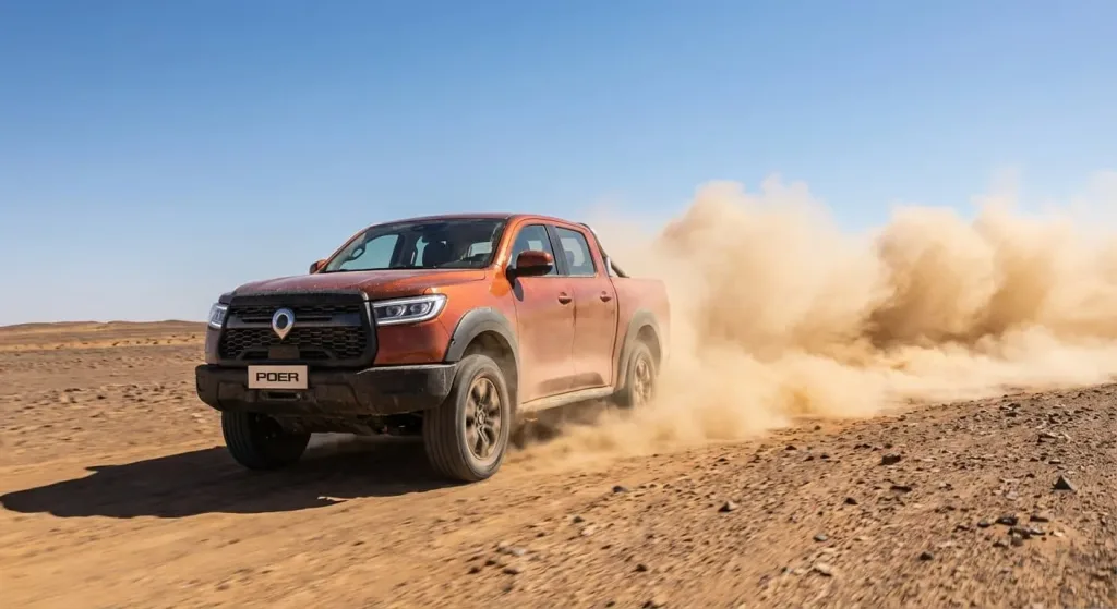 chinese pickup truck (GWM Poer) driving through desert terrain